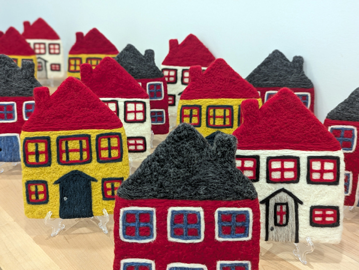 A collection of felt houses inspired by the historic properties in Trinity, NL