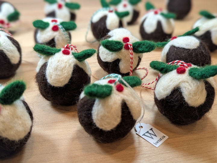 Felted decorations for a Christmas tree in the shape of Christmas puddings.